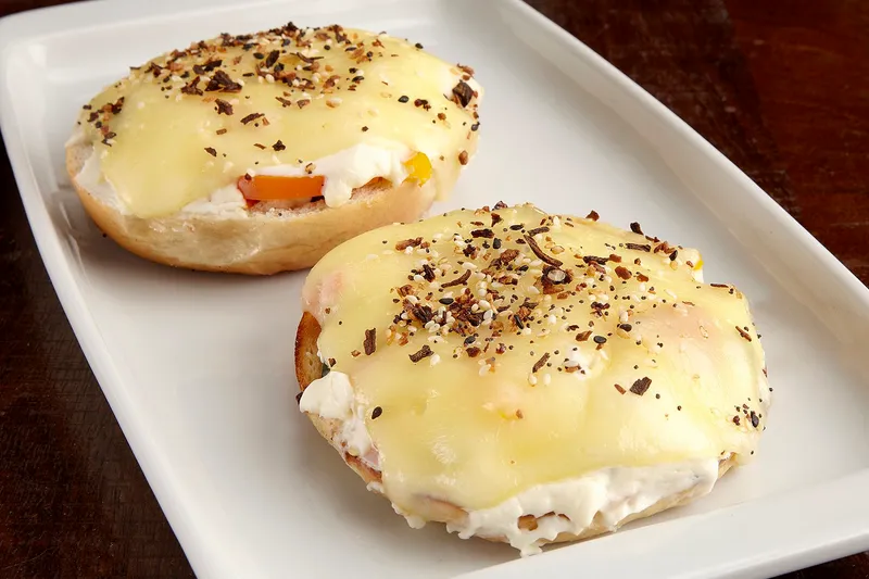The Brooklyn, a scooped bagel filled with veggies and melted cheese