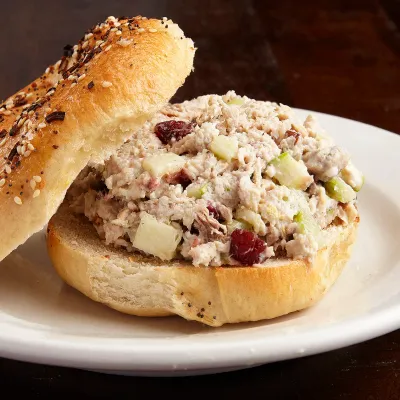 Chicken salad with cranberry on an everything bagel