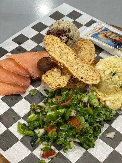 Smoked salmon with toasted bagel, egg salad and tabouli