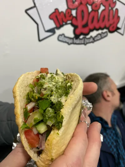 An eight inch sub loaded with chopped salad
