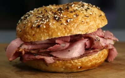 Pastrami piled onto an everything bagel