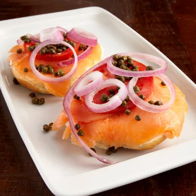 Smoked salmon platter with capers, tomato and red onion