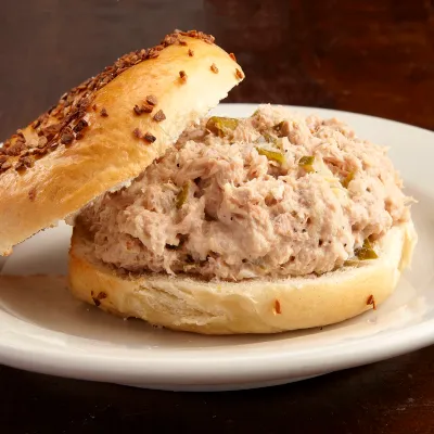 Tuna salad on a bagel with lettuce